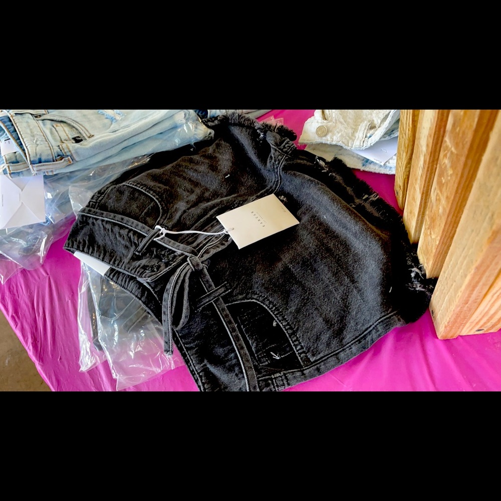 Dusty. Black shorts
